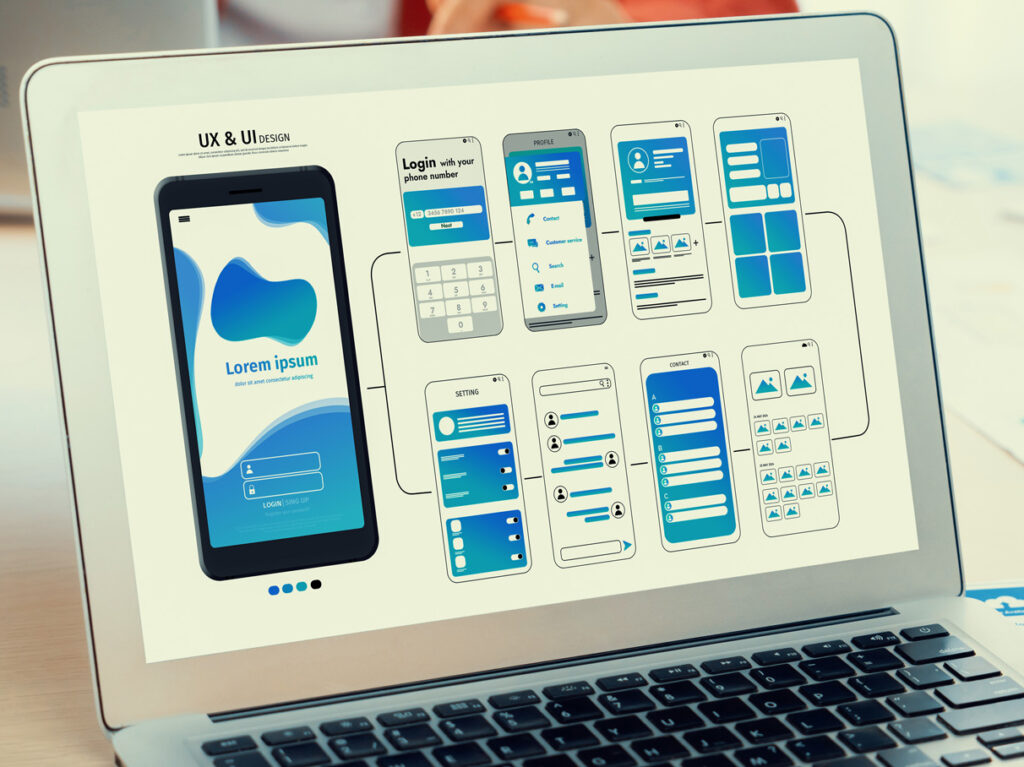 Panorama banner of startup UX developer or company employee design user interface or UI prototype for mobile application or website software with software display on laptop monitor in office. Synergic