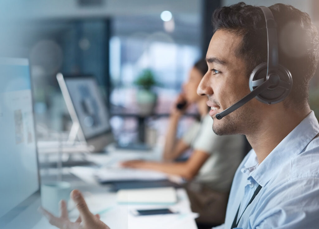 Crm, mockup or man in a telemarketing call center helping, talking or networking online via microphone. Contact support, consultant or insurance agent in communication at customer services or sales.