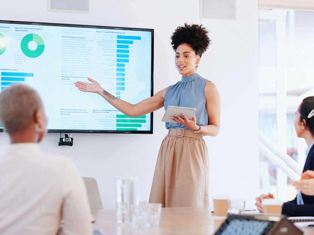 Business woman, seminar success and applause with tablet and screen, stats and ppt, infographic and team support. Thank you, business meeting with black woman speaker and marketing statistics.